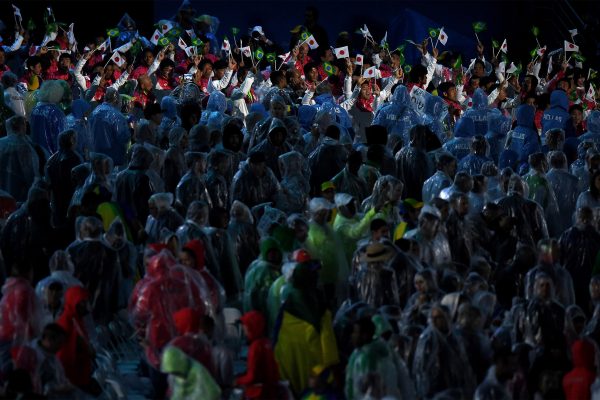 Japanese athletes march-on while heroes of the games were being honoured