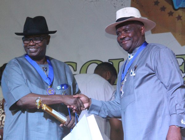 R-L Rivers State Governor, Nyesom Wike Presenting the Grand Service Star of Rivers State Award [GSSRS] to Godwin Abbe during the Rivers State Golden Jubilee Awards and houours Night Weekend in Port Harcourt. Photo: Nwankpa Chijioke