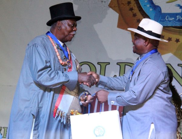 R-L Rivers State Governor, Nyesom Wike Presenting the Grand Service Star of Rivers State Award [GSSRS] to King Alfred Diete Spiff First Military Governor of Rivers State during the Rivers State Golden Jubilee Awards and houours Night Weekend in Port Harcourt. Photo: Nwankpa Chijioke