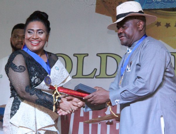 R-L Rivers State Governor, Nyesom Wike Presenting the Governor's Medal of Hounor Award [GMH] to Nolly Wood Actress, Hilda Dokubo during the Rivers State Golden Jubilee Awards and houours Night Weekend in Port Harcourt. Photo: Nwankpa Chijioke