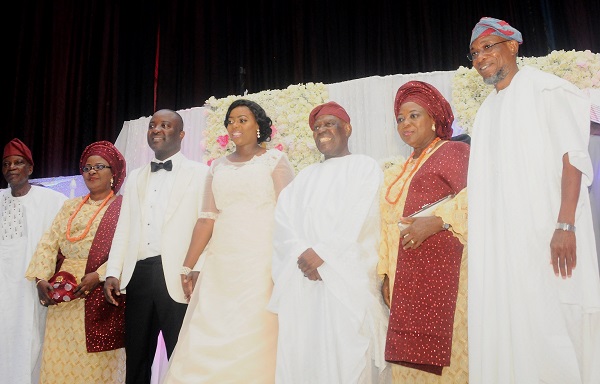 From right: Governor State of Osun, Ogbeni Rauf Aregbesola; Bride's Parents, Chief and Mrs. Adebisi Akande, Newly wedded couple, Wuraola Akande & Olawale Sholabi, and groom's parents, Pastor and Mrs. Olajide Sholabi, at the wedding ceremony between the families of Chief/ Mrs Akande and Pastor/Mrs Sholabi , at Thomas Hall, International Convention Centre, University of Ibadan, Oyo State, on Saturday 10-6-2017.