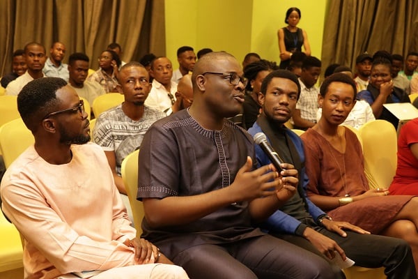 Chude Jideonwo, Co-Founder, RED and Yale Greenberg World Fellow answering making contributions during one of the panel discussions