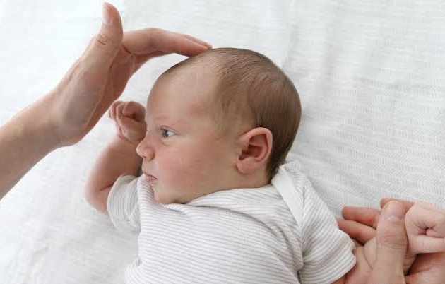 Soft spot on baby head dangers