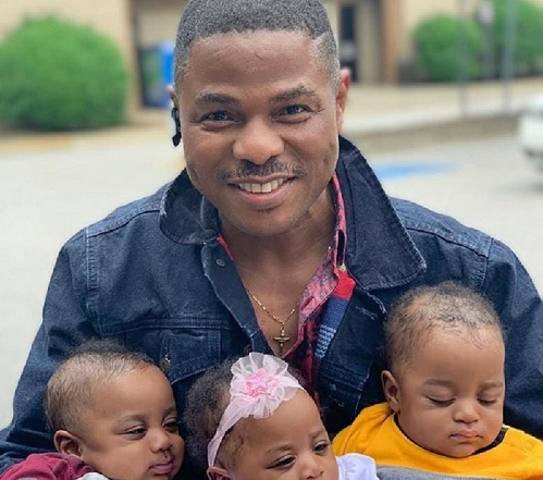 Yinka Ayefele poses with his triplets in first public photo