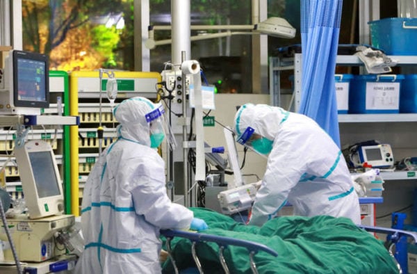 Medical staff treat a coronavirus patient at Zhongnan hospital, Wuhan University © China Daily/Reuters