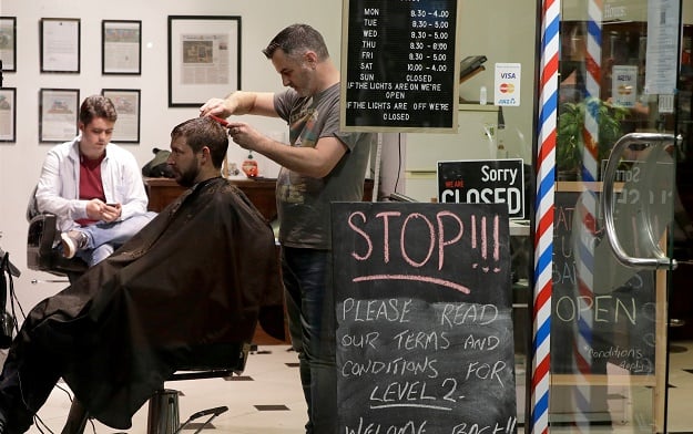 Midnight queues as New Zealand barbers reopen after 3 days without new COVID-19 cases
