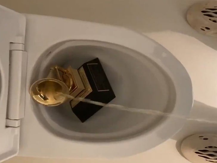 VIDEO: Kanye West pees on his Grammy award in Twitter rant against Universal