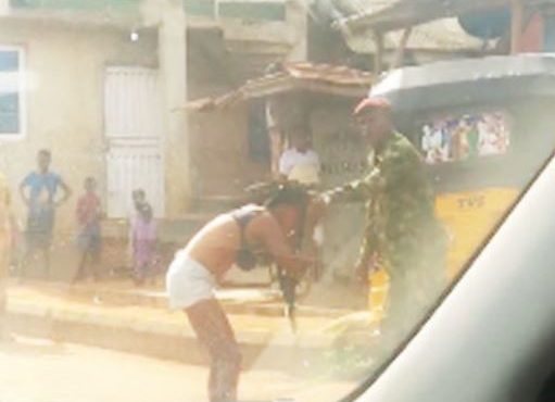 TRENDING VIDEO: Soldier strips lady over 'indecent dressing' in Ogun