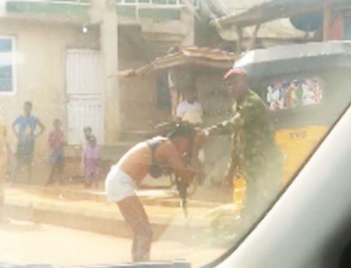TRENDING VIDEO: Soldier strips lady over 'indecent dressing' in Ogun