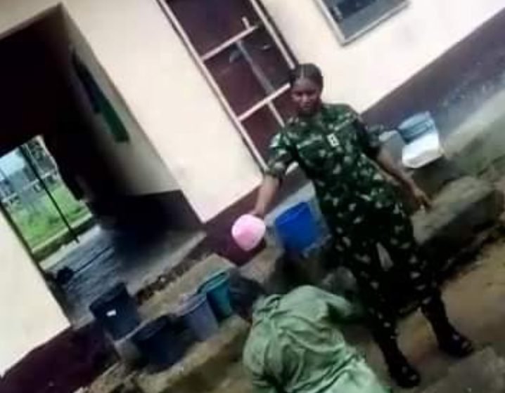 VIDEO: Soldier bathes corps member with dirty water 'over argument' in Calabar