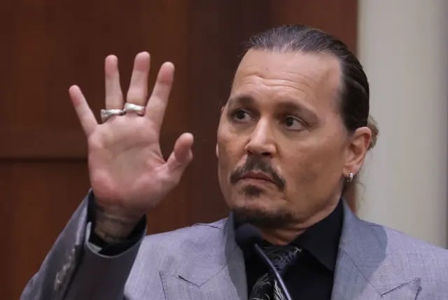 Johnny Depp claims ex-wife cut his finger with bottle in spousal abuse trial