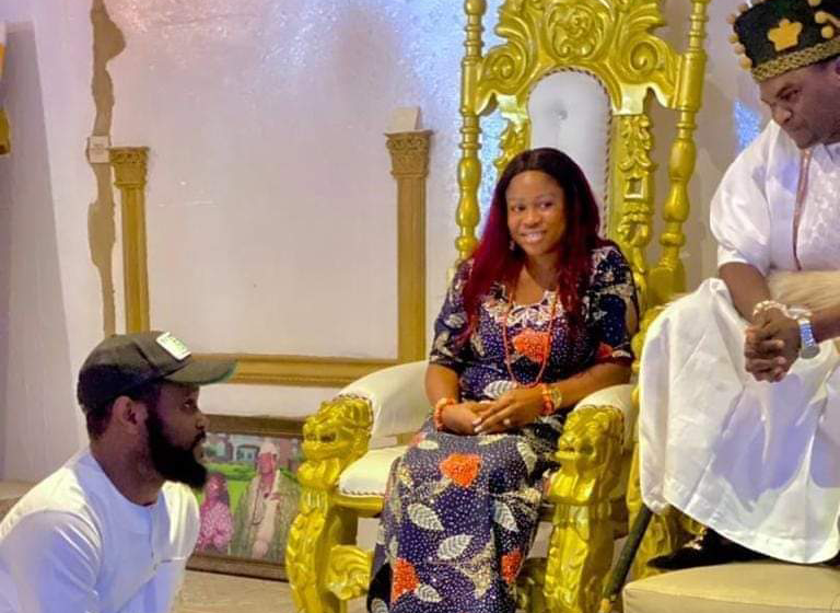 reactions as Seyi Tinubu sits at monarch's feet