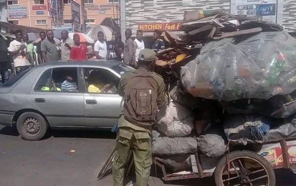 PHOTOS: Man in NYSC uniform spotted pushing truck in PH