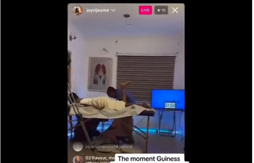 VIDEO: Nigerian lady attempting Guinness World Record for longest massage collapses