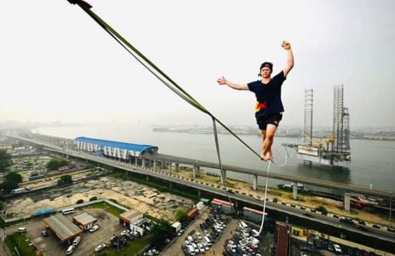 World record holder Jaan Roose walks on rope in Lagos
