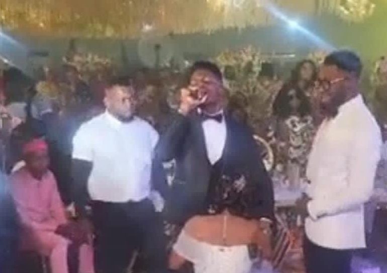 Reactions as actress Ekene Umenwa kneels before Moses Bliss on wedding day