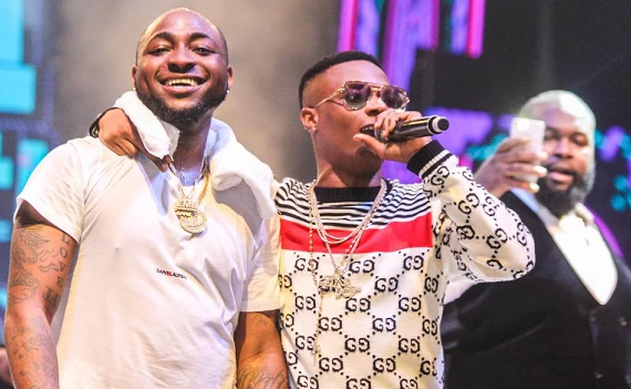 ‘Make music together if you’re friends’ — reactions as Davido bonds with Wizkid at Lagos event