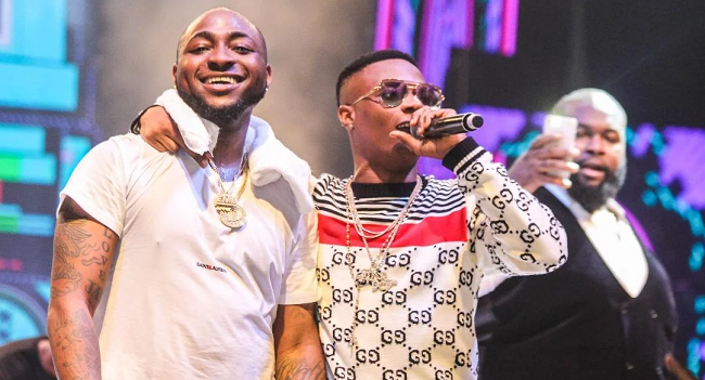 ‘Make music together if you’re friends’ — reactions as Davido bonds with Wizkid at Lagos event
