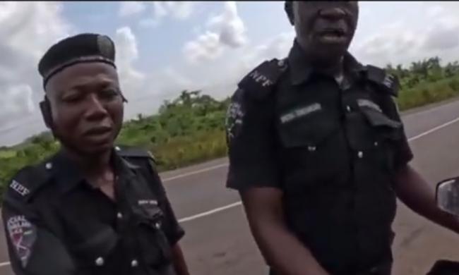 VIDEO: ‘Wetin you bring come’ -- police officers ask Dutch lady riding bike to Abuja