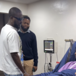 Adekunle Gold visits ailing singer Khaid in hospital