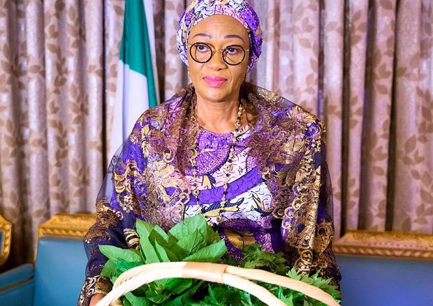 Remi Tinubu holds basket of vegetables